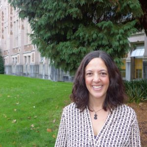 Ann Frost smiles at camera on UW campus
