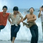 Teenage boys in wet clothes jumping in the surf in Taiwan. Still taken from the film The Boys from Fengkuei (1983).