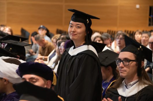 A student stands during the June 13 Jackson School Convocation.