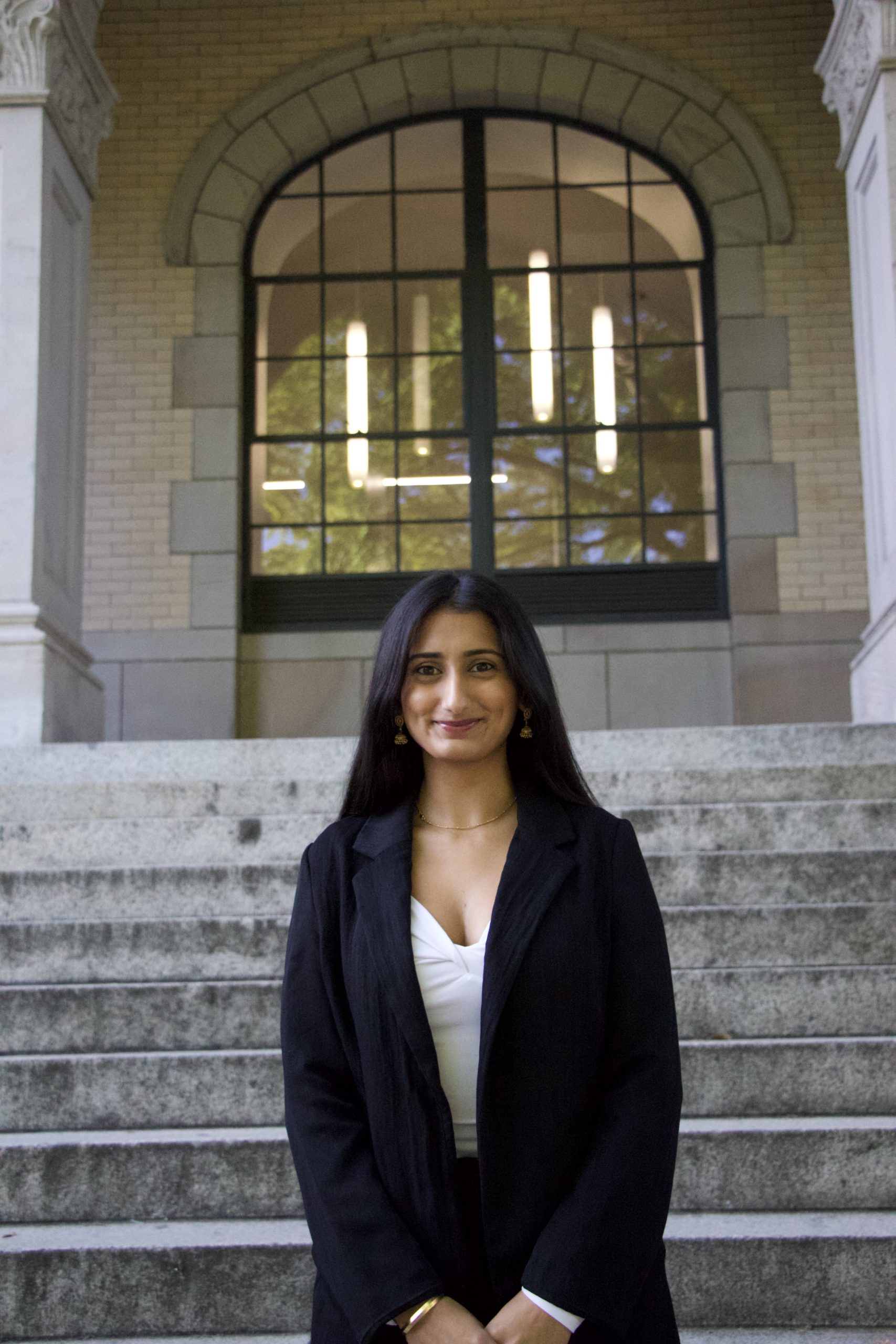 Sejal Antal stands in front of Denny Hall.